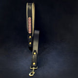 Matching Candy Black leather dog leash with pink studded panel and brass snap hook, sold as a harness and leash set